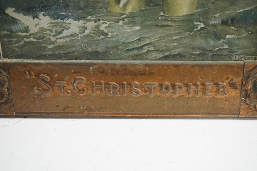 An Arts & Crafts copper picture frame embossed with shells and titled ‘St. Christopher’, housing a print of Saint Christopher carrying the christ child, 46 x 36cm